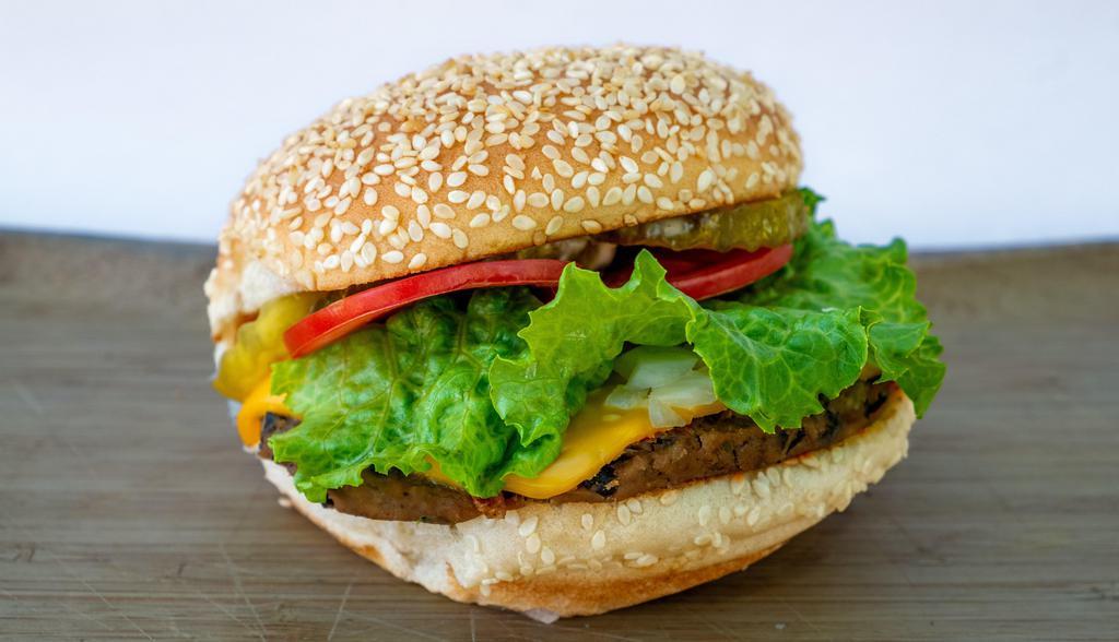 Black Bean Burger · Homemade vegetarian black bean burger. This burger comes with cheese, lettuce, tomatoes, onions, pickles, and house sauce on a toasted sesame bun.