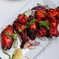 Tandoori Wings · Chicken wings marinated overnight with spices, yogurt, ginger, garlic and then cooked in our...