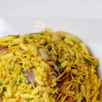 Bhelpuri · The quintessential image of street food. Puffed rice mixed with onion, potato, cilantro, swe...