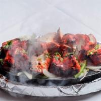 Chicken Tikka · Boneless chicken breast marinated with yogurt, ginger and garlic paste and then cooked in ta...