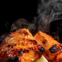 Tandoori Salmon · Salmon marinated in herbs and Indian spices then barbecued in tandoor oven.