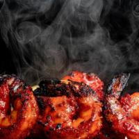 Tandoori Shrimp · Shrimp marinated in freshly ground spices and grilled in tandoor.