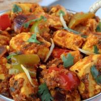 Kadai Paneer · Chunks of fresh farm cheese cooked in a special wok with fresh tomatoes, onions & bell peppe...
