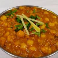 Chana Masala · Chickpeas curry cooked with Indian spices.