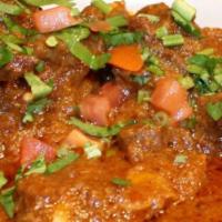 Butter Chicken · Chicken cooked with bold spices and gentle flavors in a delicate combination of tomatoes and...