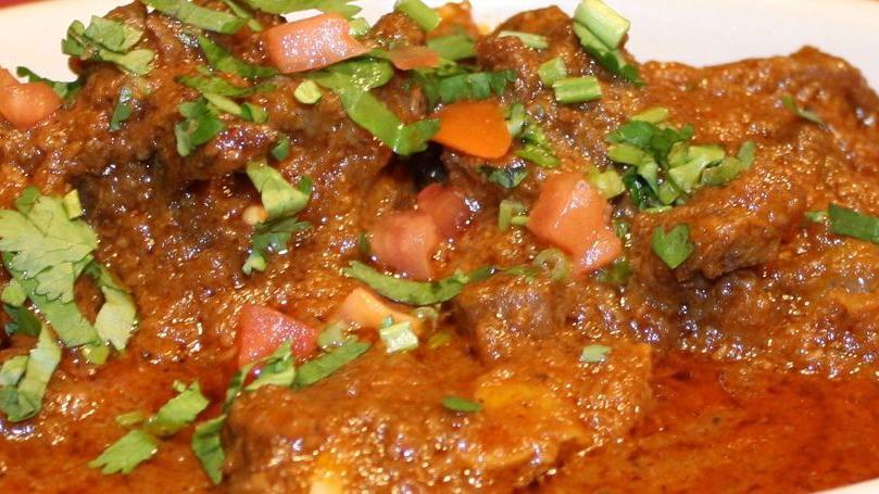 Butter Chicken · Chicken cooked with bold spices and gentle flavors in a delicate combination of tomatoes and butter finished with cream.