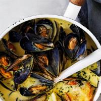 Mussels · Served in a white wine garlic lemon sauce or Spicy Marinara Sauce