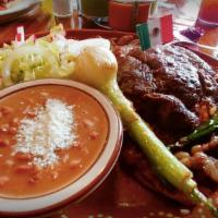 Carne Asada · Steak, beans, rice, salad, chive, fried jalapeño.