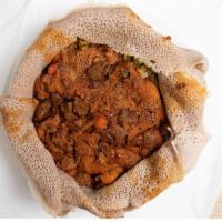 Tibs Firfir · Cubes of beef cooked with injera, Spicy or non-spicy.
