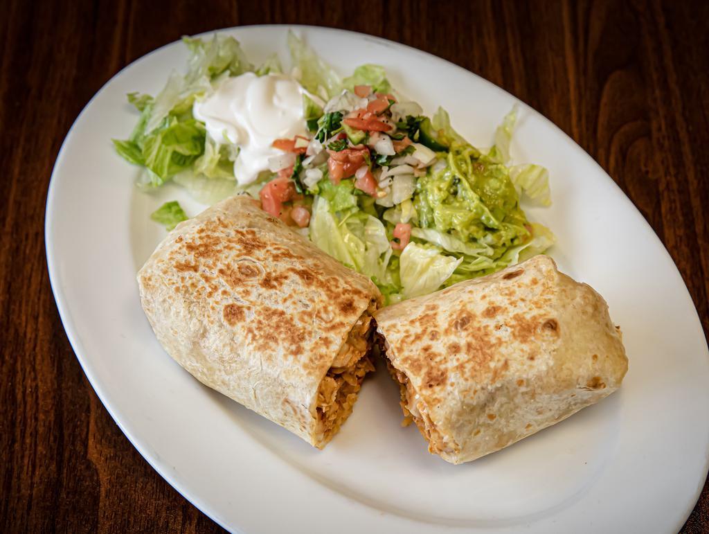 Chorizo Burrito (Mexican Sausage) · Soft flour tortilla stuffed with rice beans cheese and one choice of meat served with sour cream pico de gallo and guacamole.