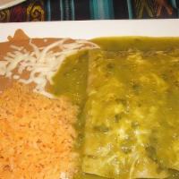 Chicken Green Enchiladas · Soft corn tortillas stuffed with chicken meat and topped with green sauce and melted cheese,...