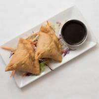 Vegetable Samosa · A popular Indian snack! Triangular pastry stuffed with potato and pea with hint of spice.
