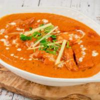 Chicken Makhani (Butter Chicken) · Tandoori chicken pieces cooked with tomatoes, butter and cream.