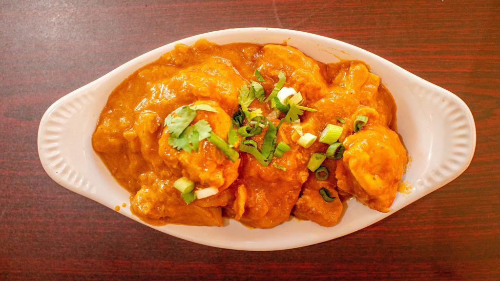 Chicken Curry · Tender chicken cubes cooked with spices and herbs.