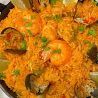 Paella Marisco · Prepared with shrimp,  squid, prawns, mussels and clams with delicious saffron flavored rice