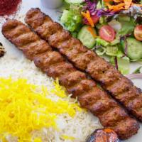 Beef Koobideh · Two skewers of seasoned ground beef kabob, charbroiled to perfection over open flames.