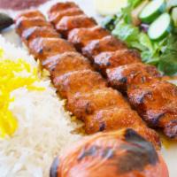 Chicken Koobideh · Two skewers of seasoned ground chicken kabob charbroiled to perfection over open flames.