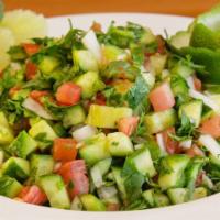 Shirazi Salad · Diced tomatoes, onions, cucumbers, and chopped parsley with our fresh lime, lemon juice and ...