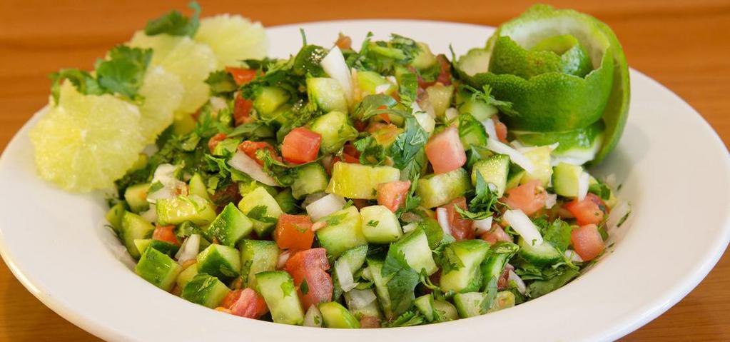 Shirazi Salad · Diced tomatoes, onions, cucumbers, and chopped parsley with our fresh lime, lemon juice and olive oil dressing.