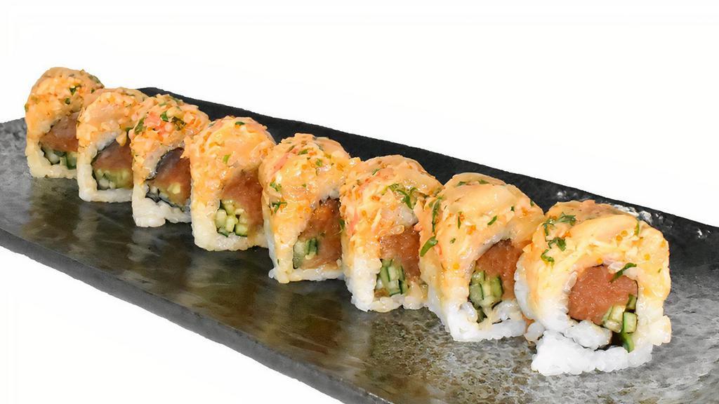 Lucky Roll · Cucumber and spicy tuna, Topped with a mix of crab salad, scallops, cilantro tobico and spicy aioli