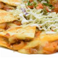 Quesadilla · Flour Tortilla, meat and cheese. 
Served with cabbage, pico de gallo, salsa and sour cream.