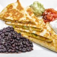 Quesadilla · Vegetarian. Flour tortillas filled with monterey jack and cheddar cheeses, bell peppers, oni...