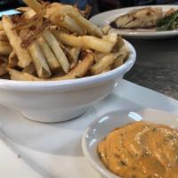 Hand-Cut Frites · Served with smoked paprika aioli  dipping sauce.