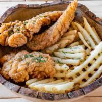 Tendies & Fries · Seasoned chicken tenders with a serving of parmesan truffle fries or naked fries