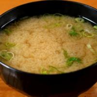 Miso Soup · Home-made dashi with seaweed, tofu and scallion.