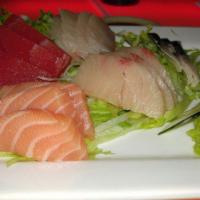Sashimi Deluxe · 13 pieces assorted sashimi & a bowl of white rice. Raw fish.