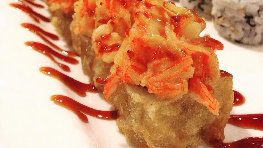 Ocean Roll · Baked scallop, shrimp & crabmeat on top.
