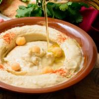 Hummus · Chickpeas pureed with tahini, fresh lemon juice and olive oil.
