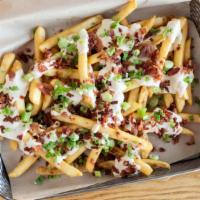 Pub Grub · Fresh cut chips or fries, topped with homemade beer cheese and chopped bacon and garnished w...