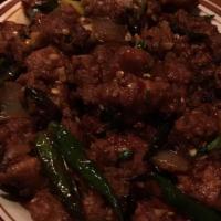 Chilly Chicken · Spicy and succulent chicken and onion dish--choice of dry or in gravy.
