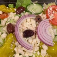 Greek Salad
 · T.C.P. Tossed Salad with feta cheese, black olives and Greek dressing.