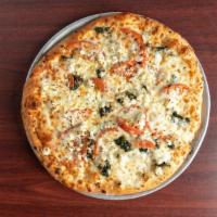 Medium Greek Pizza · Spinach, sliced tomato, feta cheese, fresh garlic, and mozzarella cheese.