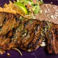 Carne Asada · Grilled steak  with rice ,beans lettuce.pico.slice avocado
And flour or corn tortillas