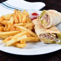 Lebanese Chicken Sandwich · Garlic sauce, French fries and pickles served on pita bread with a side of French fries, (fo...