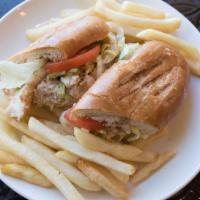 Fish Sandwich · Grilled flounder filet topped with tartar sauce or mayo, lettuce and tomato. Served with a s...