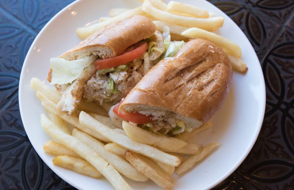 Fish Sandwich · Grilled flounder filet topped with tartar sauce or mayo, lettuce and tomato. Served with a side of French fries (for yuca, additional 20 cents).
