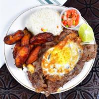 Bistec A Lo Pobre · Grilled steak served with French fries, white rice, plantain, pico de gallo and topped with ...