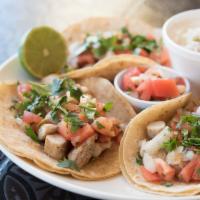 Grilled Chicken Tacos · Three soft corn tortilla filled with grilled chicken, onion, pico de gallo and cilantro with...