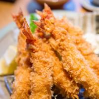 Fried Shrimp Basket W/ Fries & Tartar Sauce · Fresh fried shrimp with a side of golden crispy fries and tartar sauce.