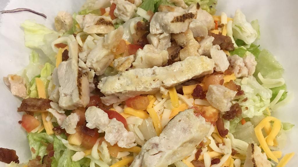 Grilled Or Blackened Chicken Salad · Grilled chicken, blend cheese, bacon bits and diced tomatoes.