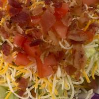 House Salad · Blend cheese, bacon bits, diced tomatoes and croutons.