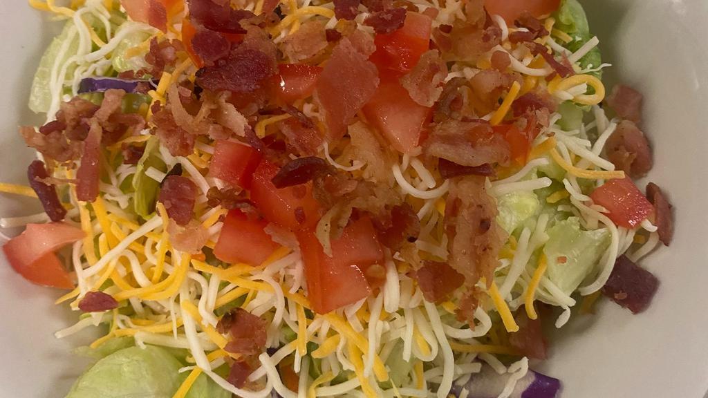House Salad · Blend cheese, bacon bits, diced tomatoes and croutons.