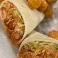 Buffalo Wrap · Breaded chicken tossed hot or mild, shredded lettuce and blend cheese. Served with ranch or ...