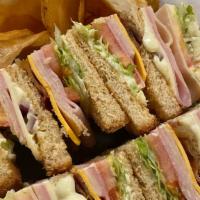 Club Sandwich · Turkey, Ham, American, Swiss, Bacon, Onion, Lettuce, Tomato and Mayo on Wheat Bread.
