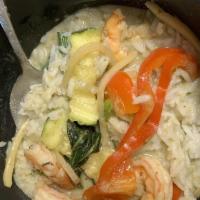 Green Curry · Green beans, zucchini, bamboo shoots, bell peppers, basil, and coconut milk with a choice of...