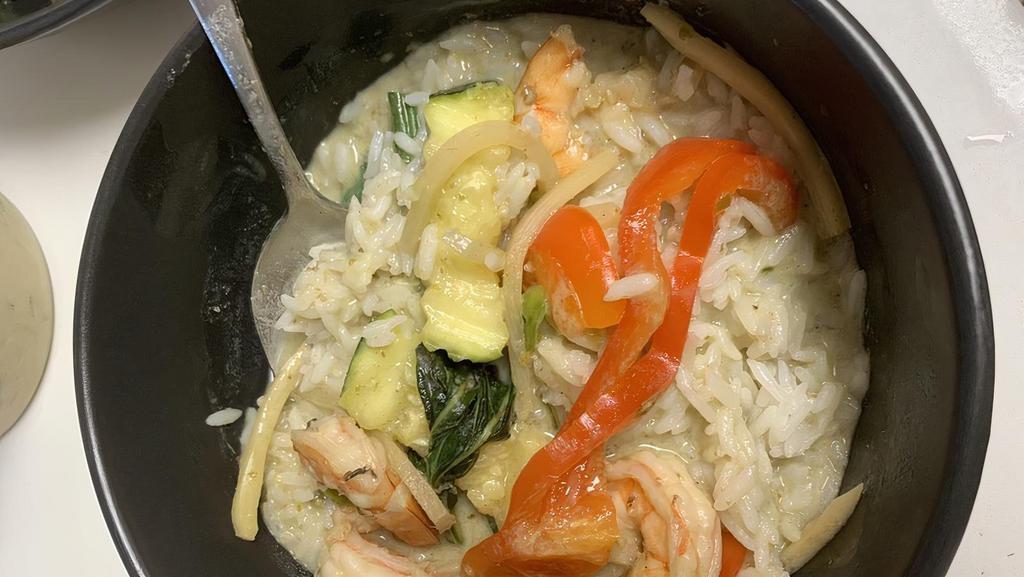 Green Curry · Green beans, zucchini, bamboo shoots, bell peppers, basil, and coconut milk with a choice of meat.